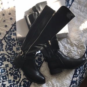 Black boots by Olivia Miller